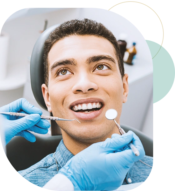 cheerful african american man with during examination in dental clinic