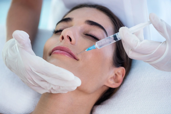 Woman receiving botox injection