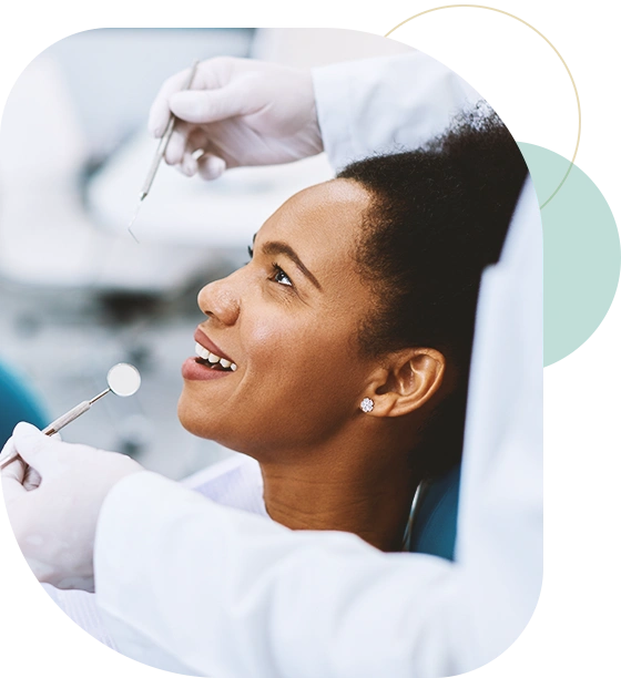 Happy black woman having dental health examination at dentist's office.